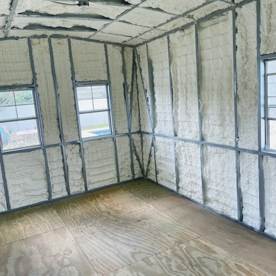 Closed-cell spray foam insulation applied to wall cavities in a residential project in North Providence